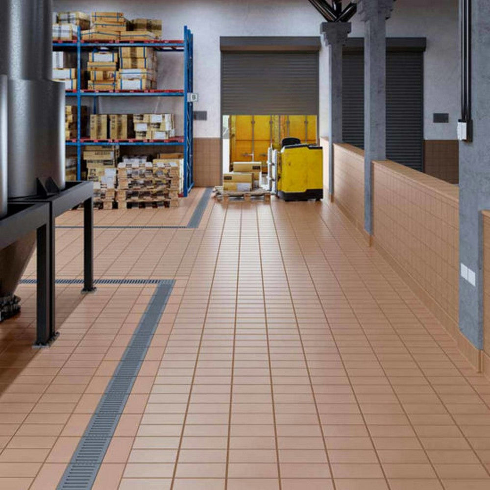 Alfagres 6x6 Quarry Tile installed in Warehouse, Image is showing a quarry tile flooring from Alfagres Commercial, 6x6 Commercial Tiles in a room, Image is showing a big warehouse, with racks, and pallets, also a forklift, and a quarry tile in sahara color on floor